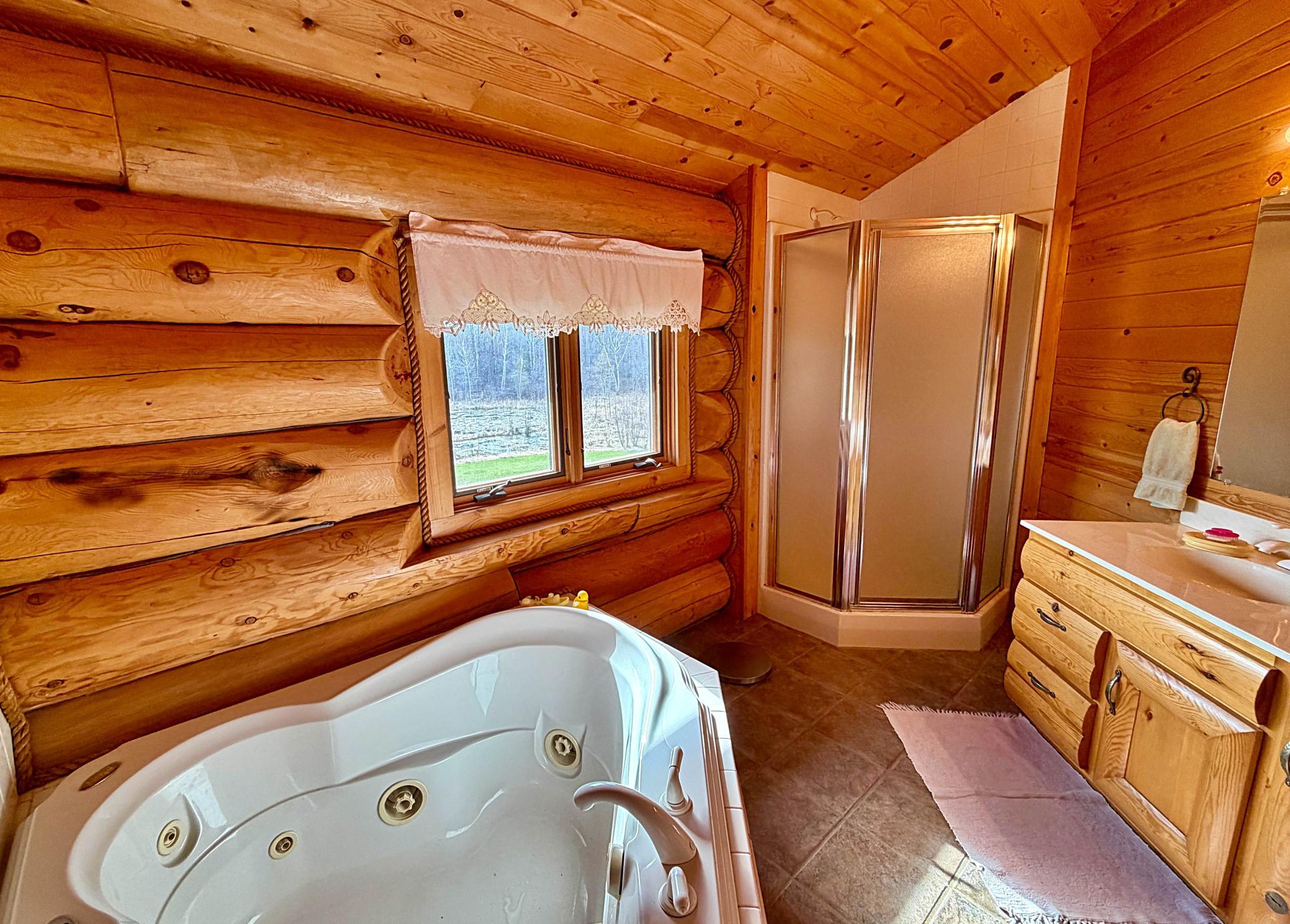 Bathroom upper jetted tub with shower .jpg
