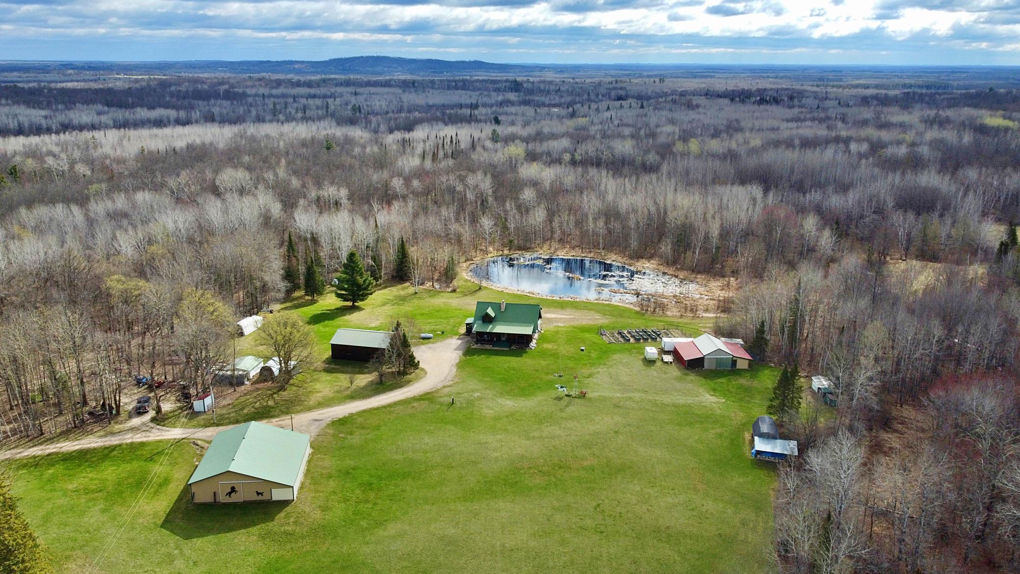 Aeiral view over property with pond.jpg
