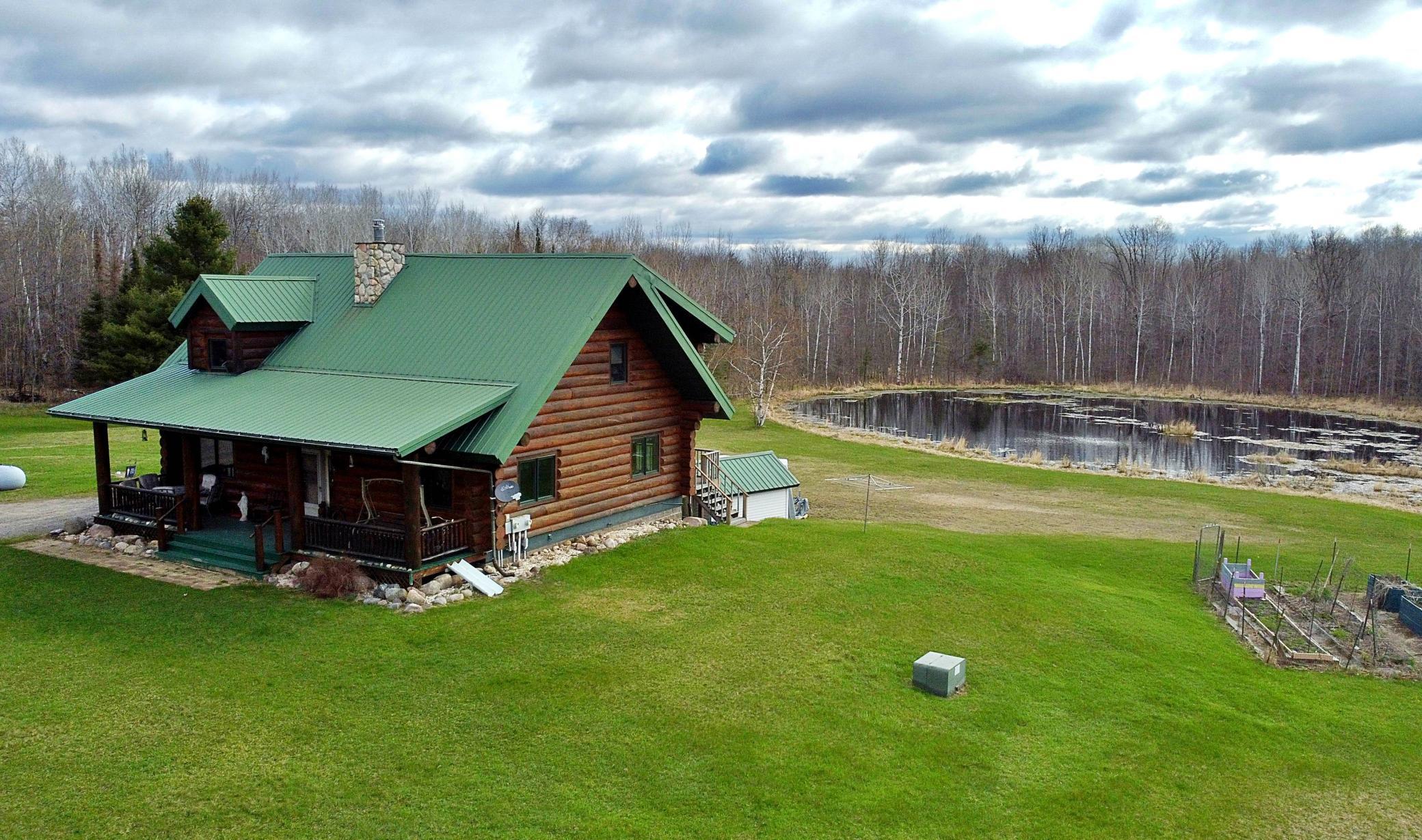 View of log cabin with pond.jpg