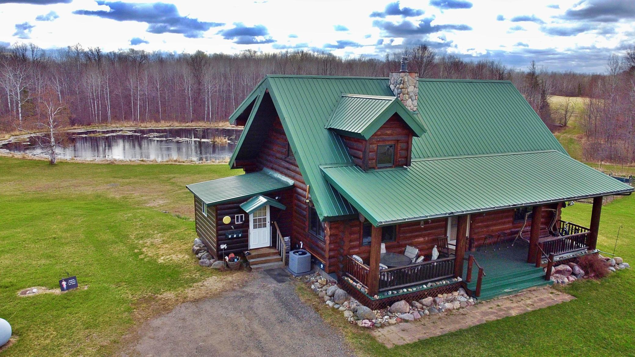 Main view of log home with pond 2.jpg