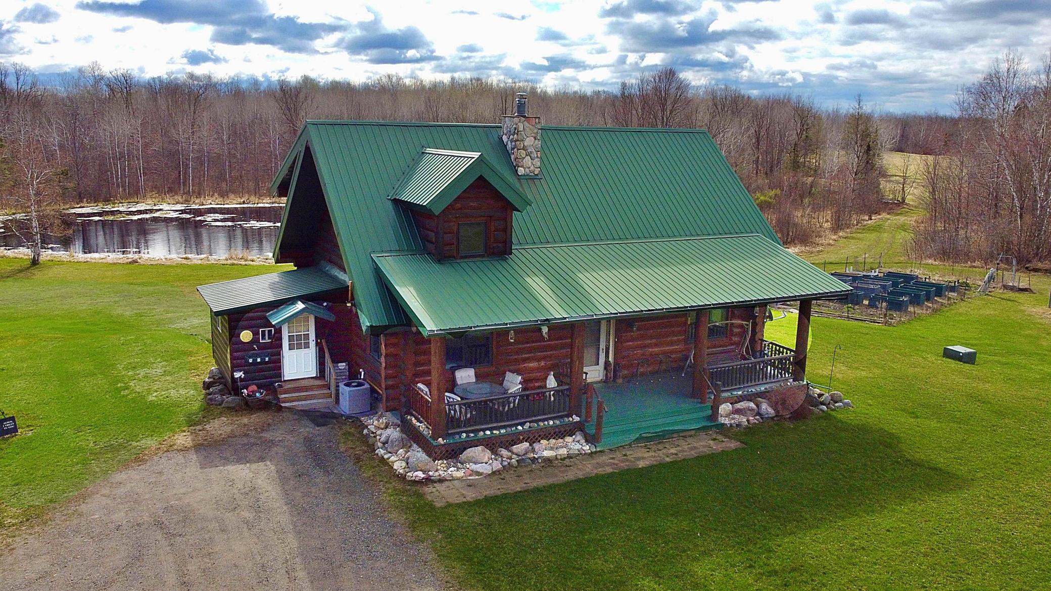 Main view of log home with pond.jpg