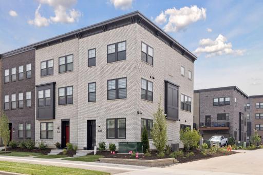 Modern Design in the Heart of Highland Bridge. End-unit row home offering contemporary style, abundant natural light, and low-maintenance living.