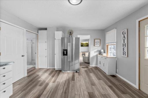 Beautiful kitchen featuring durable vinyl plank flooring, offering the perfect blend of style, warmth, and easy maintenance for everyday living and entertaining!
