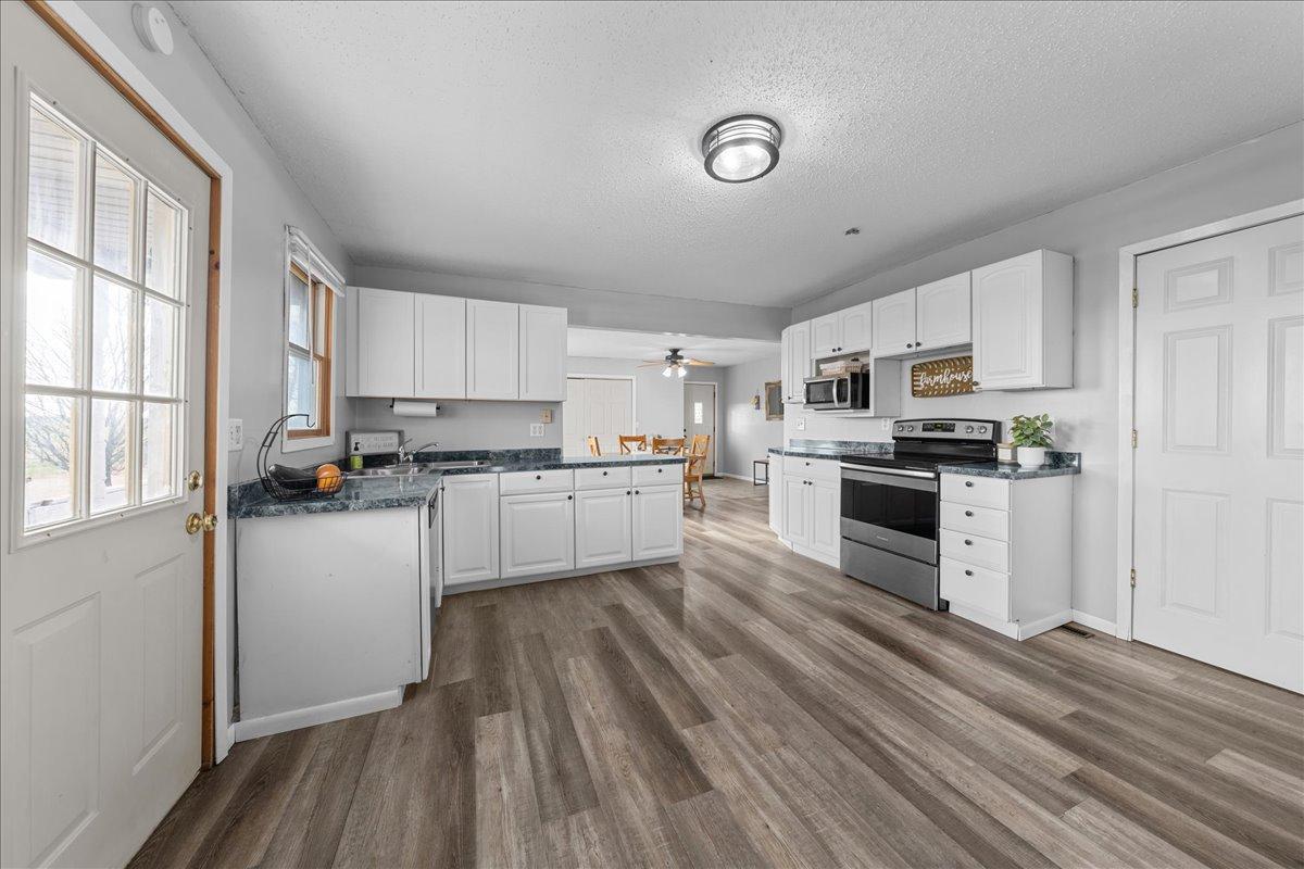 Step off the porch and into your charming farmhouse kitchen,.jpg