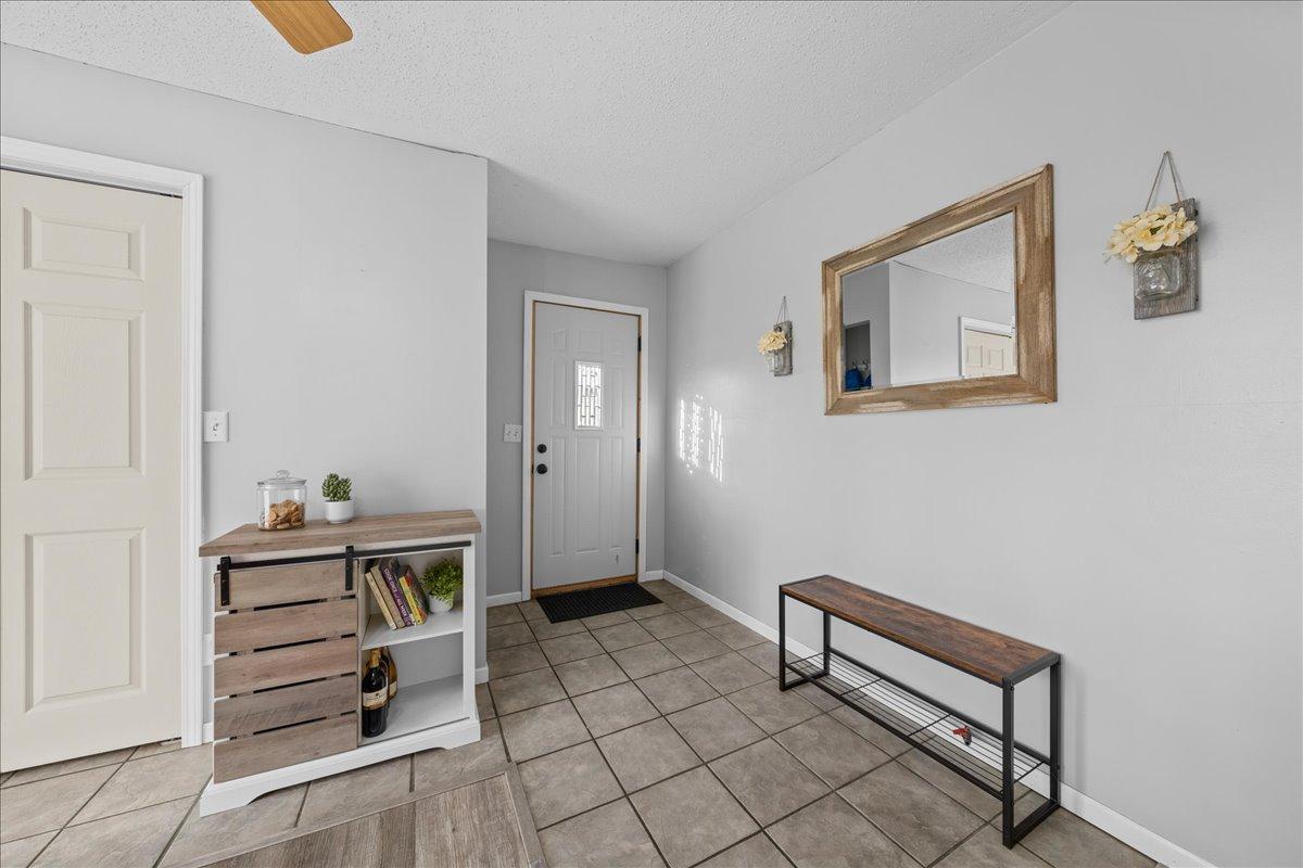 The side entrance welcomes you directly into a warm and inviting dining space, perfect for everyday meals.