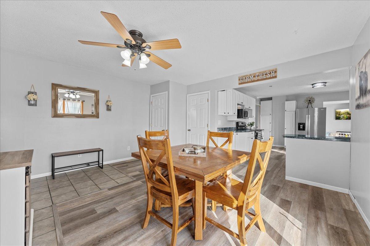 The open kitchen and dining space create a warm, welcoming layout perfect for gathering, entertaining, and enjoying everyday farmhouse living.jpg