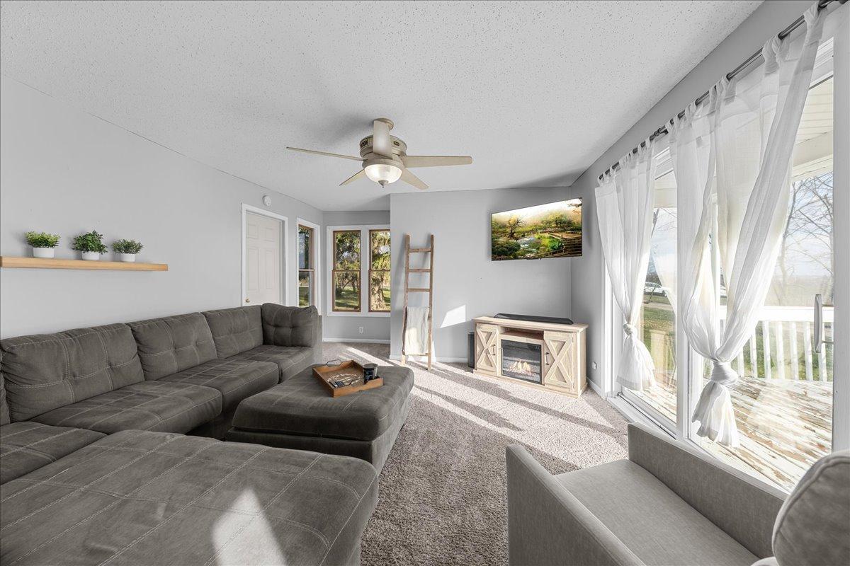 An inviting family room filled with natural light and incredible views of the surrounding countryside, creating a warm and relaxing place to gather.jpg