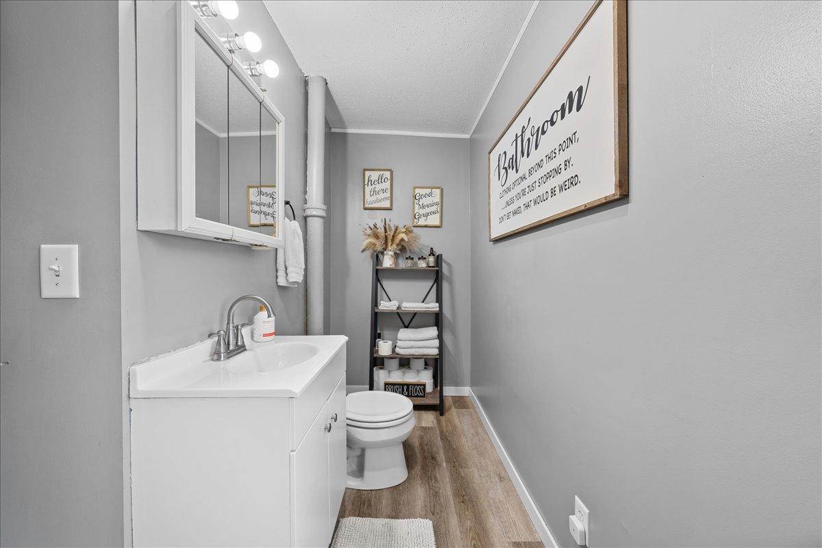 Cute main-level 3/4 bath with charming farmhouse touches, offering convenience and style.jpg