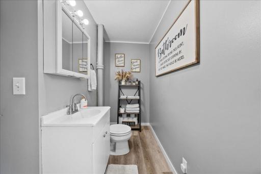 Cute main-level 3/4 bath with charming farmhouse touches, offering convenience and style.jpg