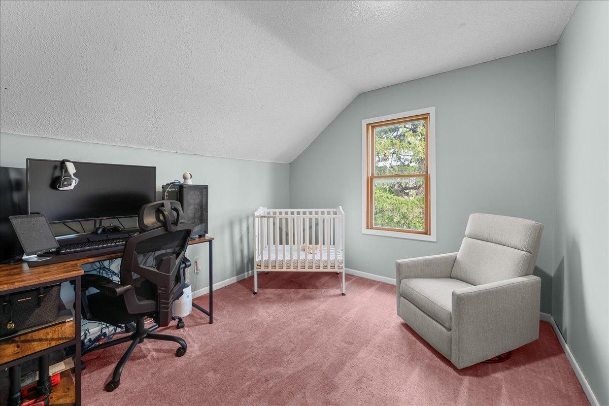 Bedroom 4 offers a cozy, light-filled space currently set up as a nursery, with flexible use for future needs.jpg