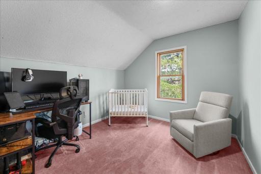 Bedroom 4 offers a cozy, light-filled space currently set up as a nursery, with flexible use for future needs.jpg