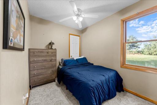 Main level bedroom offering flexible use as a home office or hobby space, providing comfort, convenience, and functional living.jpg