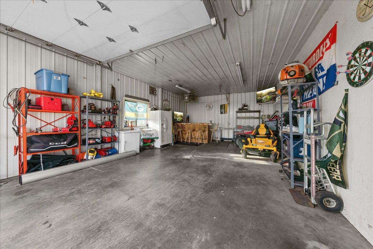 Bring your toys to the “man cave” via the single-door side —perfect for easy access to the shed/garage for storage, hobbies, or weekend projects.jpg