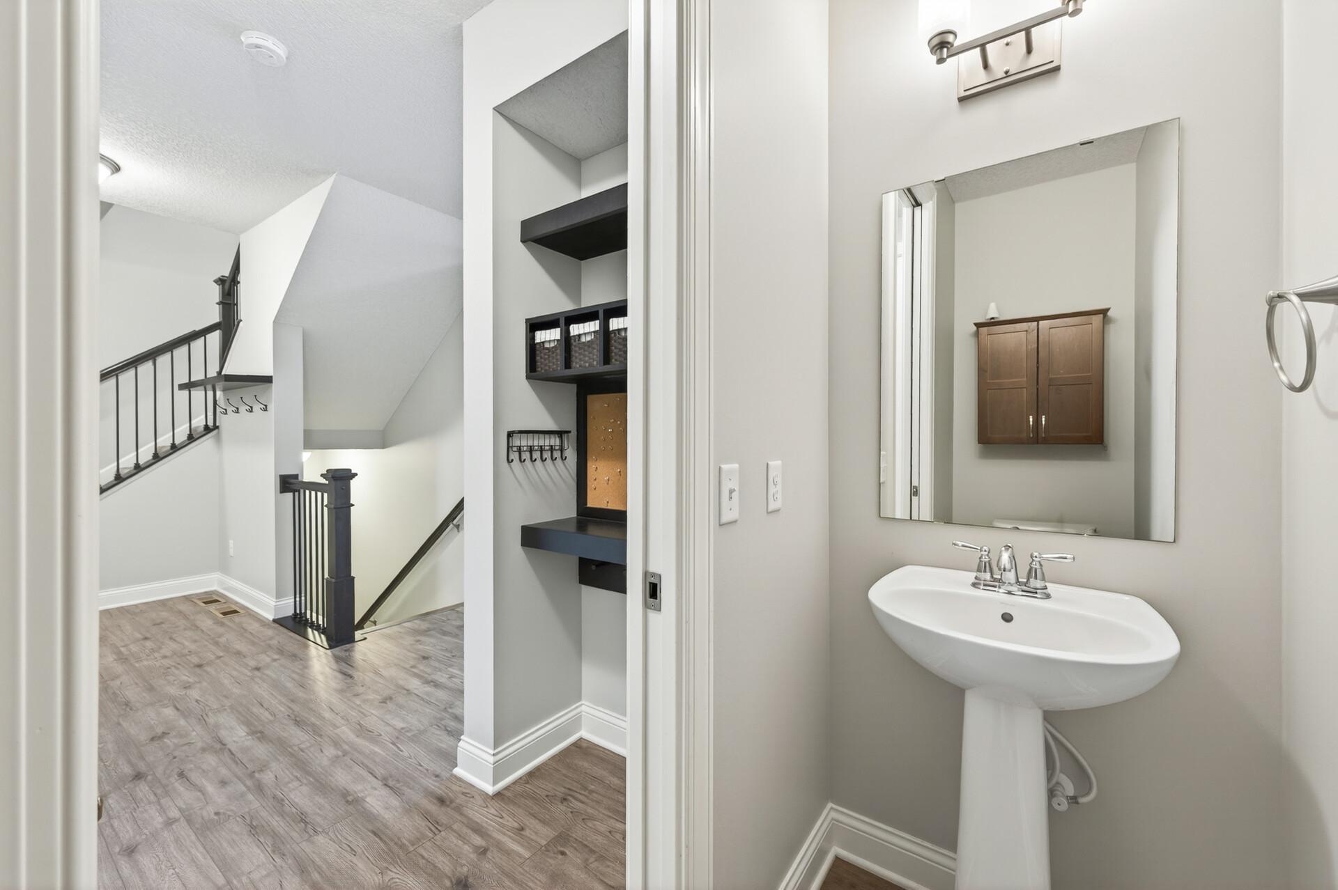 Convenient drop zone by garage entry door.