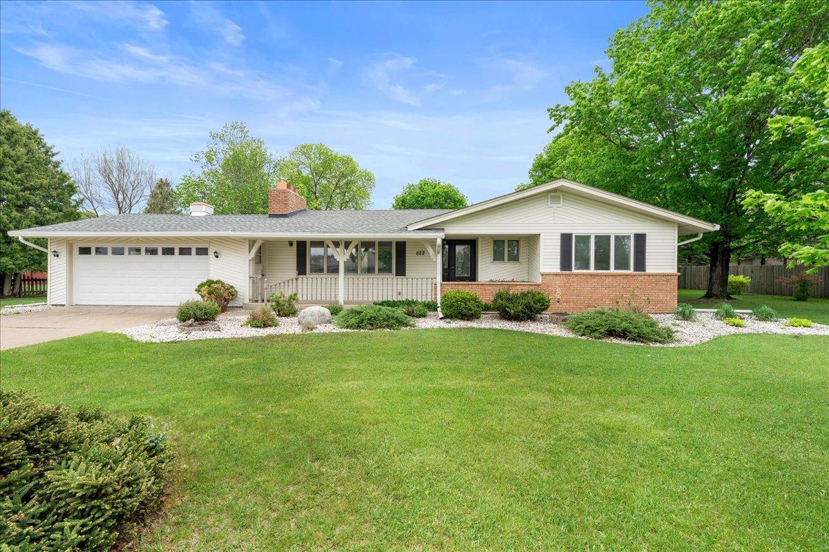 Welcome home! Enjoy the serenity of a spacious yard filled with natural beauty and abundant green space.