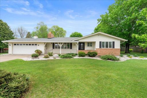 Welcome home! Enjoy the serenity of a spacious yard filled with natural beauty and abundant green space.