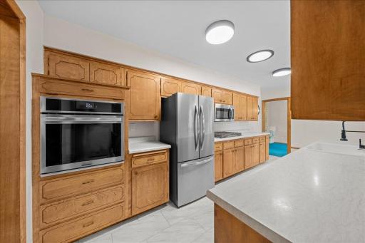 Brand-new appliances complement the kitchen's functional layout and everyday appeal.