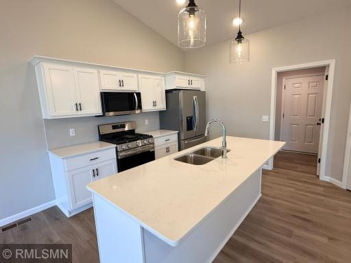 Bright and beautiful kitchen with an island larger enough to seat four!