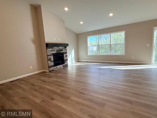 Huge windows let in lots of natural light and give you the perfect view of the wooded backyard