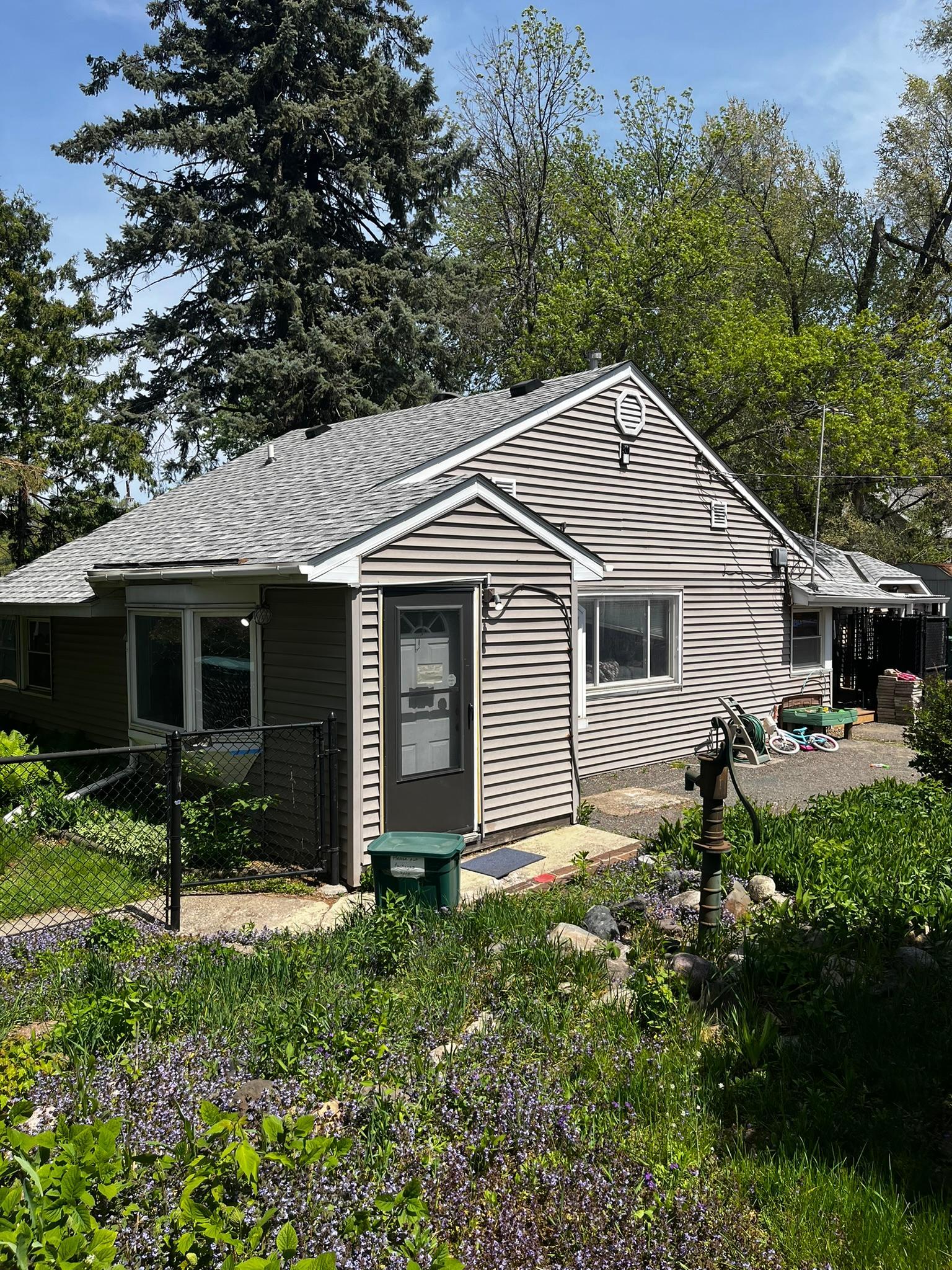 The Home Features Two bedrooms 1 Bathroom, A New Roof, Cabin Like Tongue and Groove Paneling, and a Huge Lot.