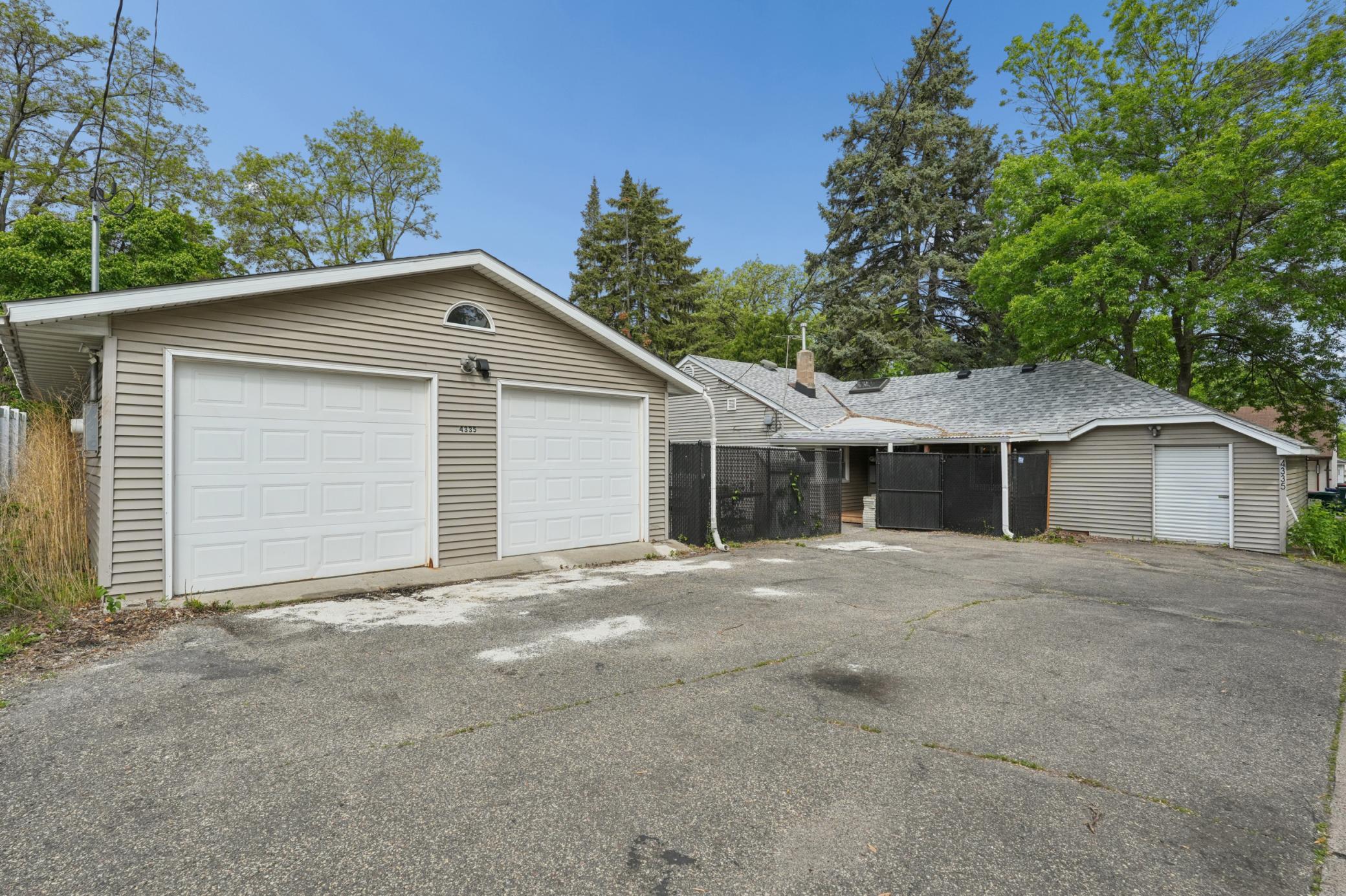 The Garage is 32' x 24' and has 8' tall garage doors. Also another Storage Shed Connected to the House. Enough Parking for 7 Cars Outside.