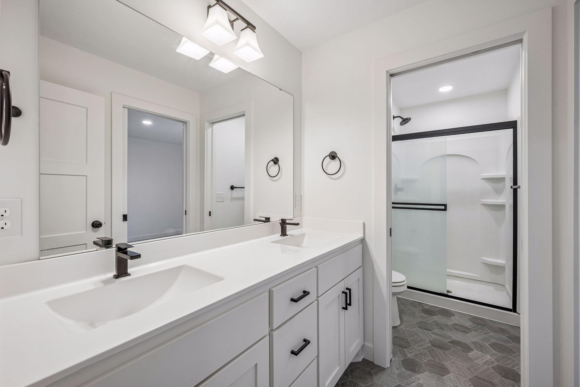 Upper level 3/4 bathroom with dual sinks