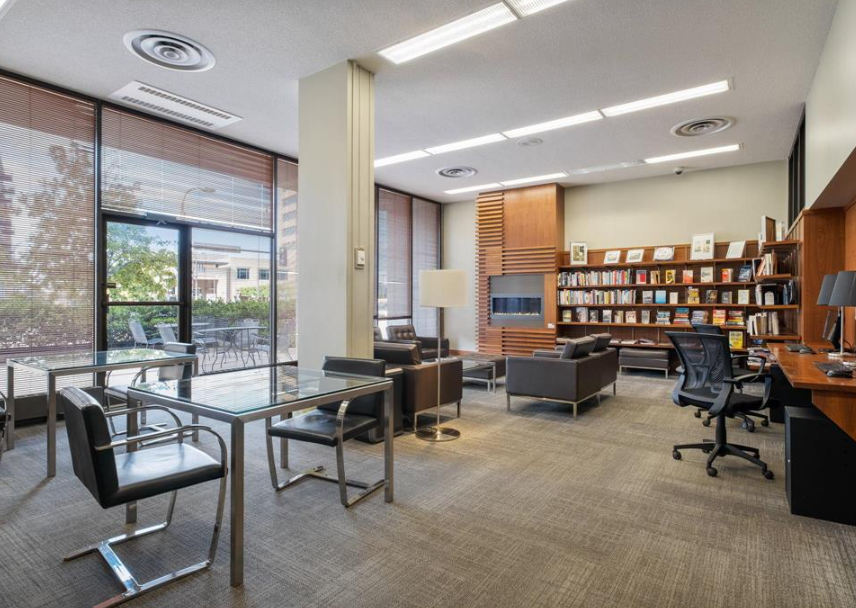 Lending Library with computers and printer for tenants use. Cozy fireplace seating area..png