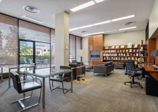 Lending Library with computers and printer for tenants use. Cozy fireplace seating area..png