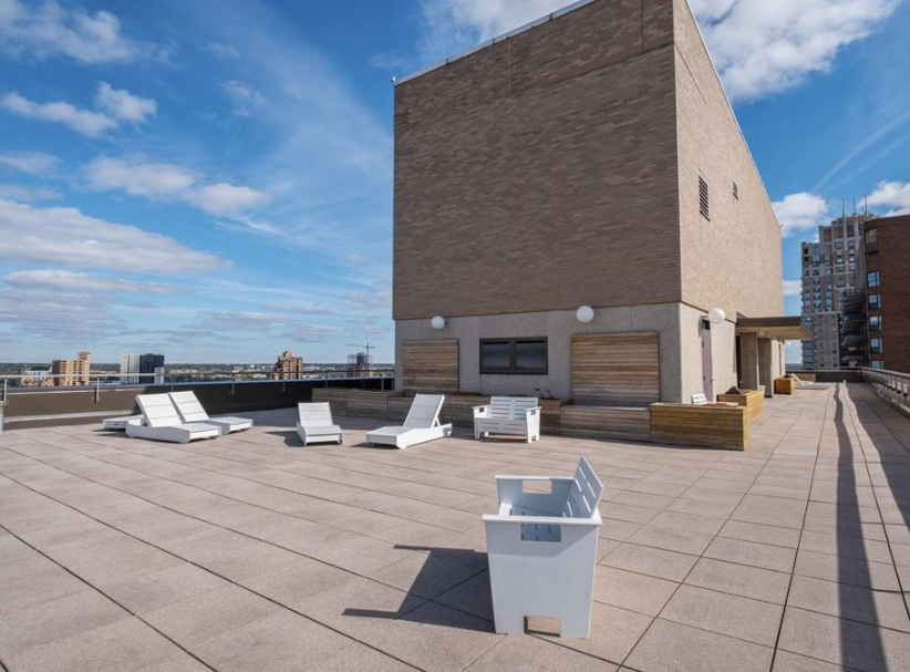 Rooftop patio perfect for tanning, stargazing. 360 rooftop view of city..png