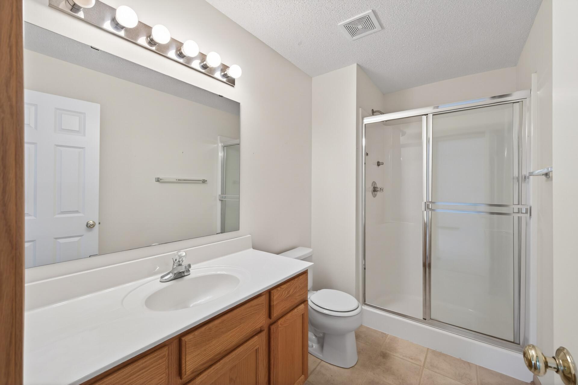 Private primary 3/4 bath with step in shower