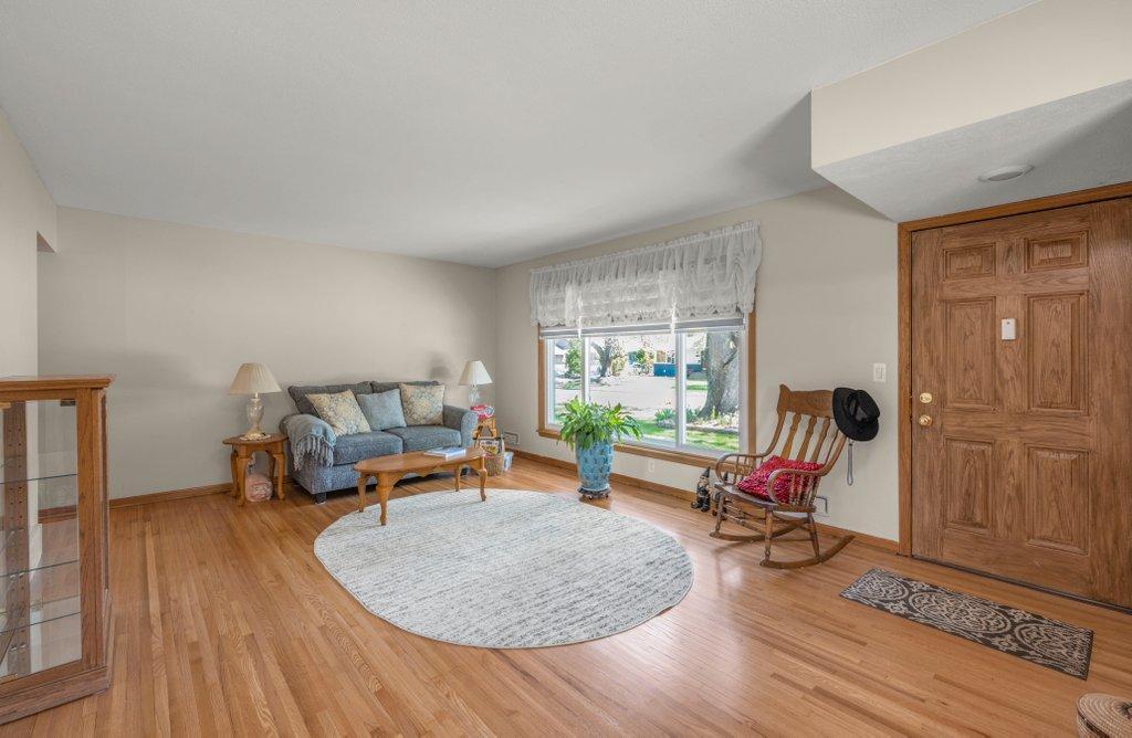 Front Living room with Large Picture Window & Recently Finished Hardwood Floors!