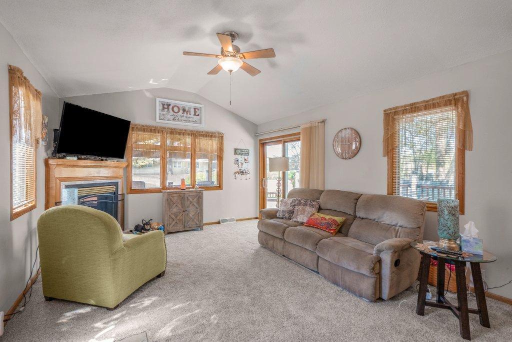 Sun filled Vaulted Main Floor Family Room w/Gas Fireplace & Walkout to the Deck & Screened Porch