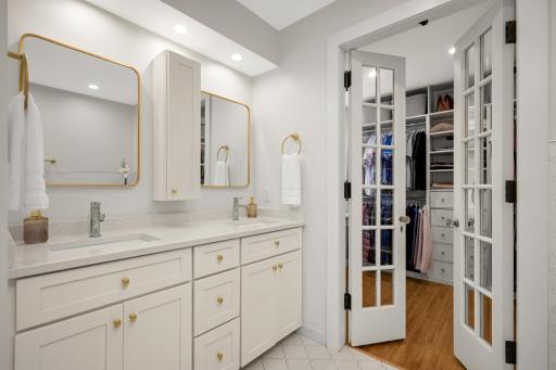 French door of the bathroom allows access to the custom walk-in closet.