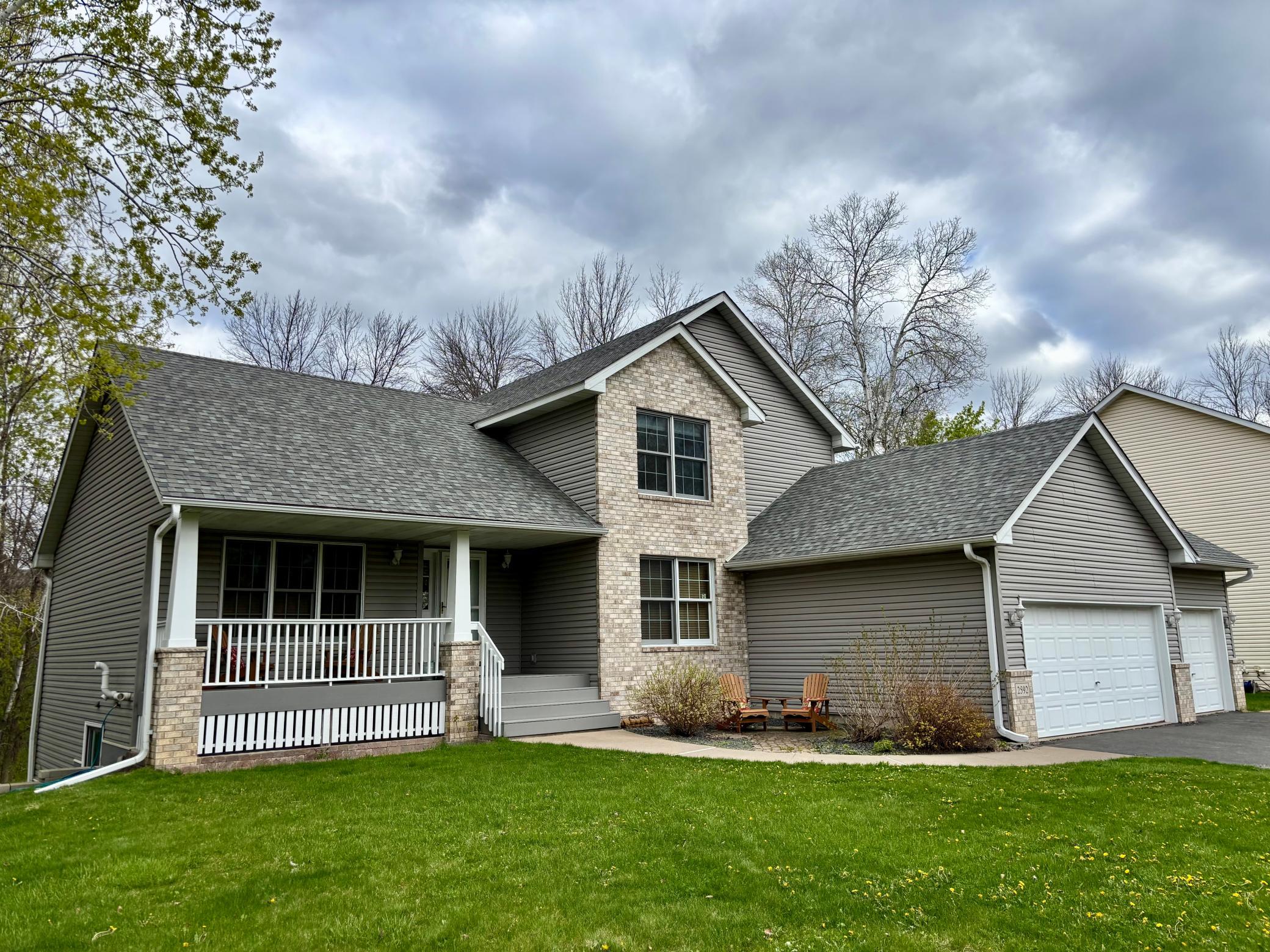 Beautiful 5 bedroom 2-story home on almost 1/2 acre lot with park-like pond & wooded views.