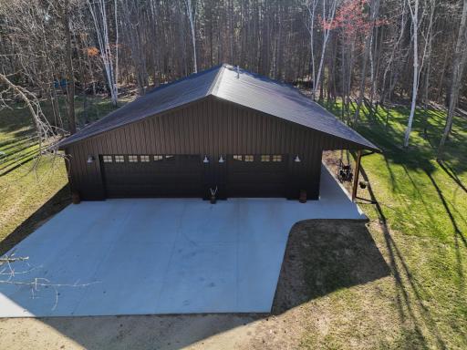 Spacious driveway and attached heated garage with plenty of parking.