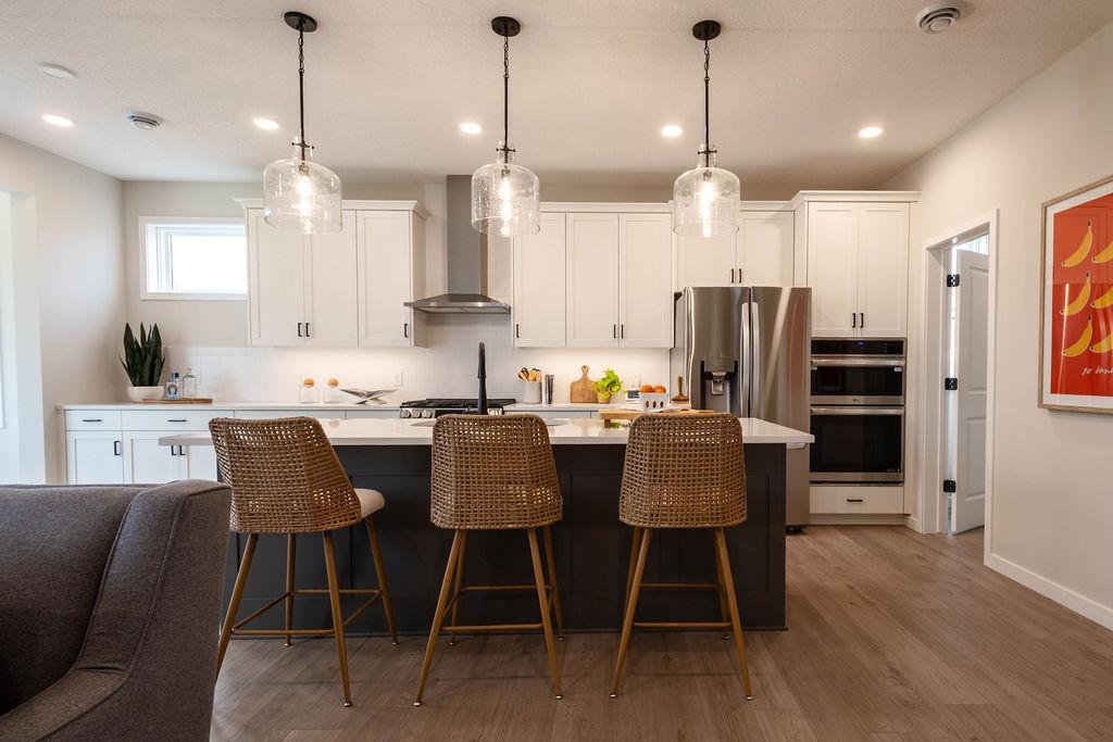 Another Robert Thomas Home, The Reiley, Sold before Print ***Prices, square footage, Photos &/or illustrations may not depict actual home plan configuration. Features, materials & finishes shown may contain options Not included. Main Floor bedroom.