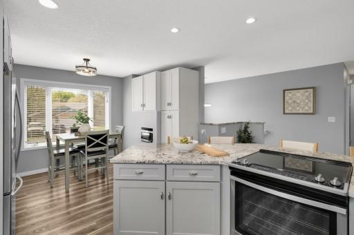Not only do you have formal dining, you also have this great informal dining area in the kitchen along with extra cupboards and a big pantry!