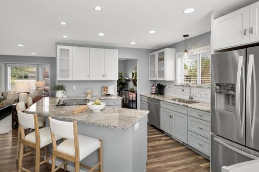 The large center island with breakfast bar seating is ideal for casual dining, entertaining, or gathering with family and friends. Soft close doors & drawers along with granite countertops are not the norm at this price range