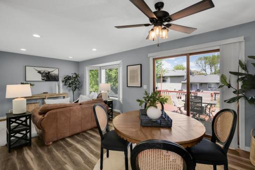 A modern ceiling fan with wood-toned blades adds both style and functionality, making this main living area perfect for both everyday living and hosting guests.