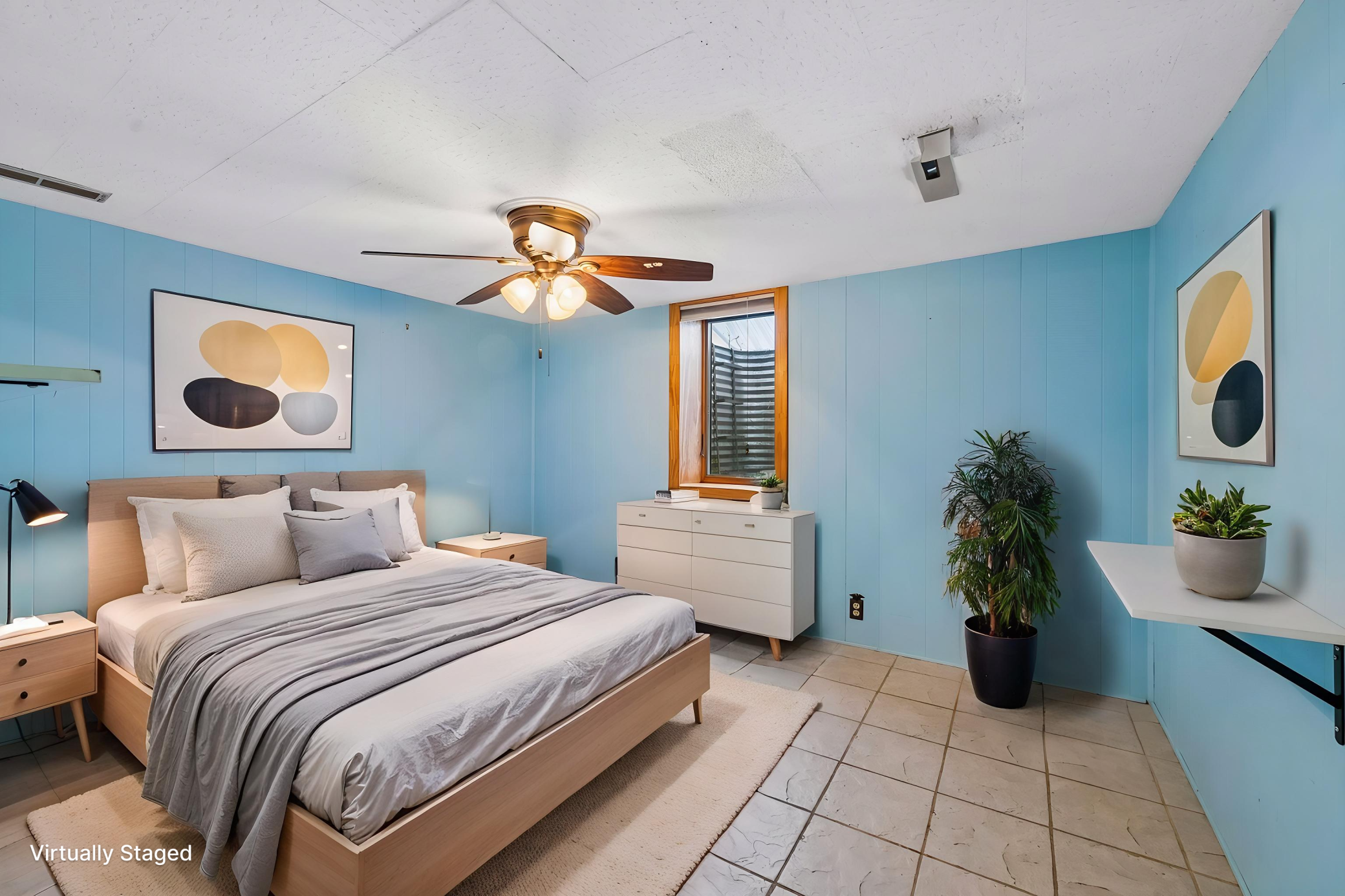Virtually staged lower level bedroom.