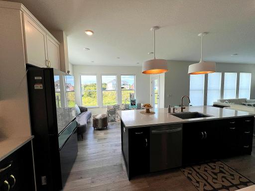 Large windows create a bright and welcoming kitchen.