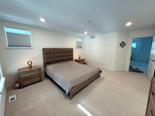 Large primary suite upstairs overlooks the backyard.