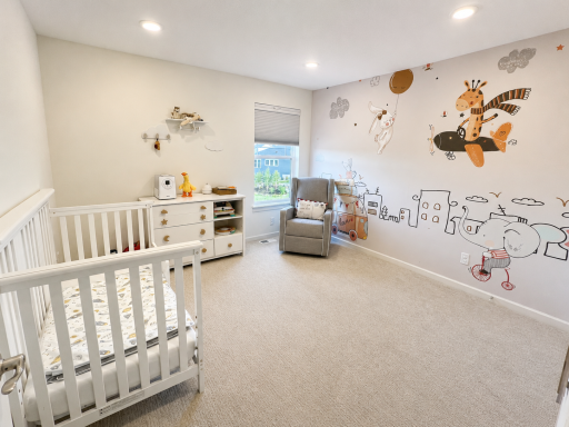 Third bedroom upstairs, with featured wall for kids.