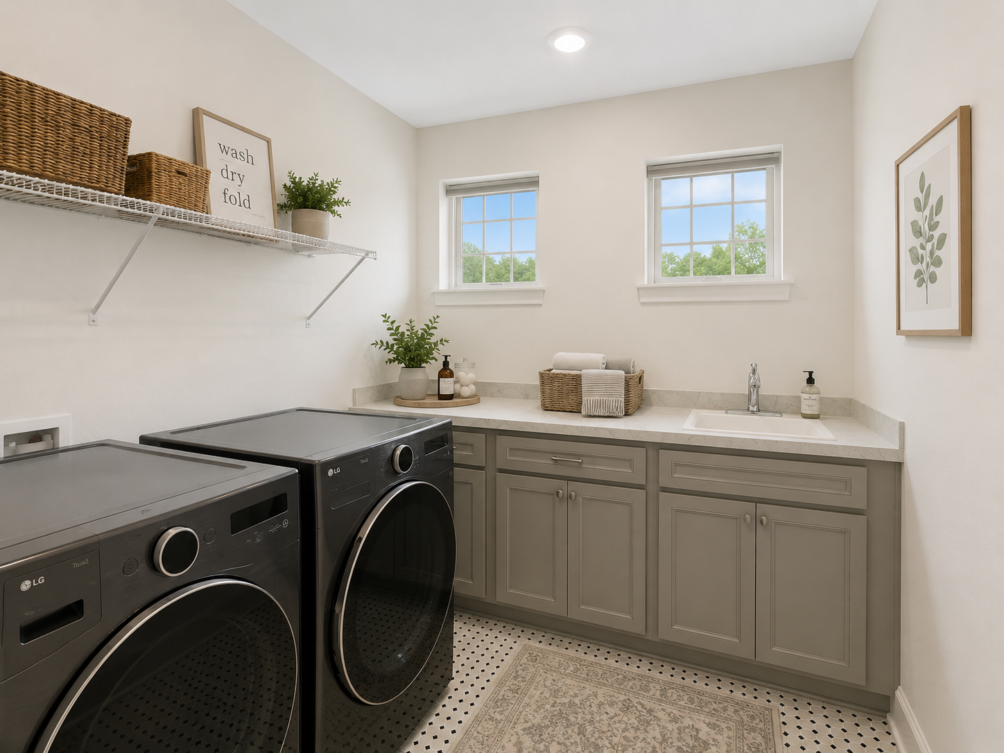 Oversized laundry room featuring built-in cabinetry, utility sink, and ample workspace to simplify daily routines-VS