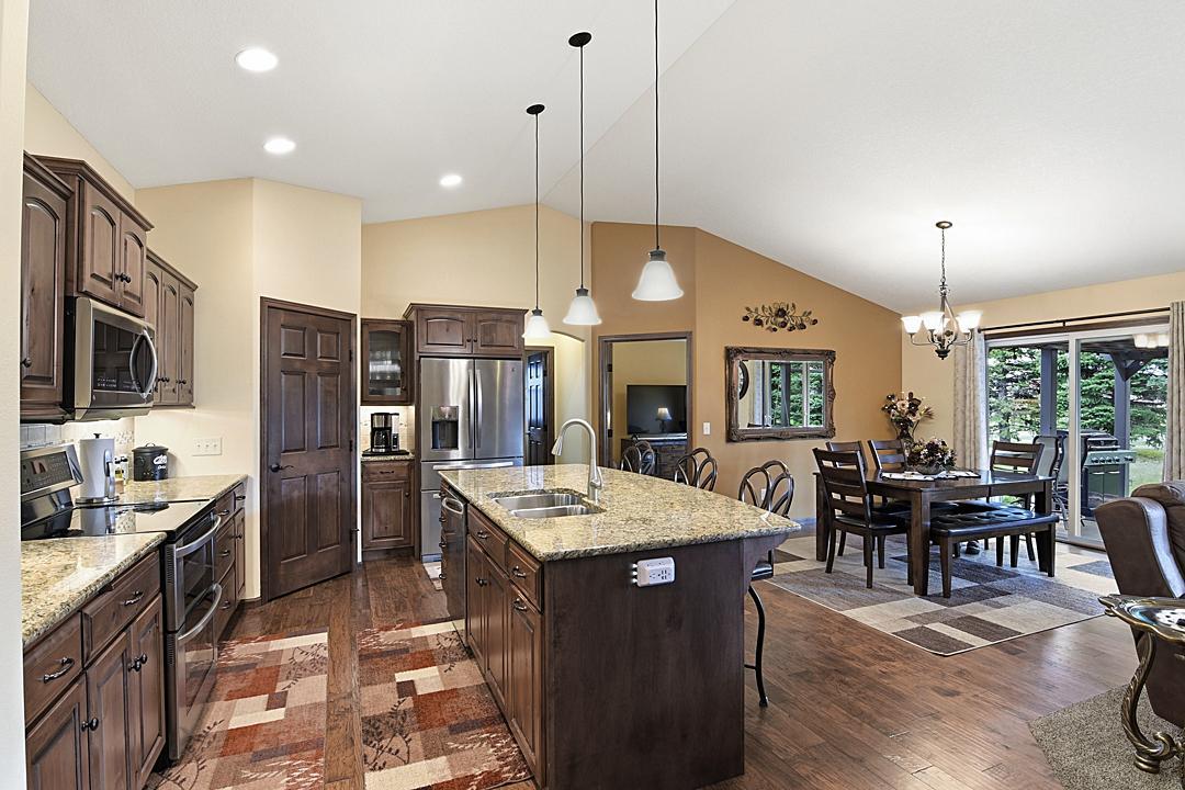 Kitchen & Dining Room; Maple Cabinets, Hickory Hardwood Floors, Granite Countertops, Stainless Appliances, Touchless Kitchen Faucet. Elegant and Functional