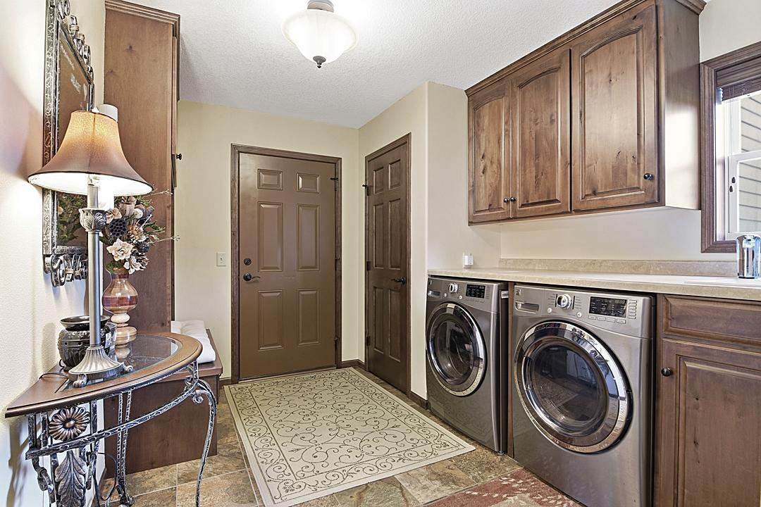 Laundry Room/Entry Way, Tile floors, Coat Closet, Lockers on the left.
