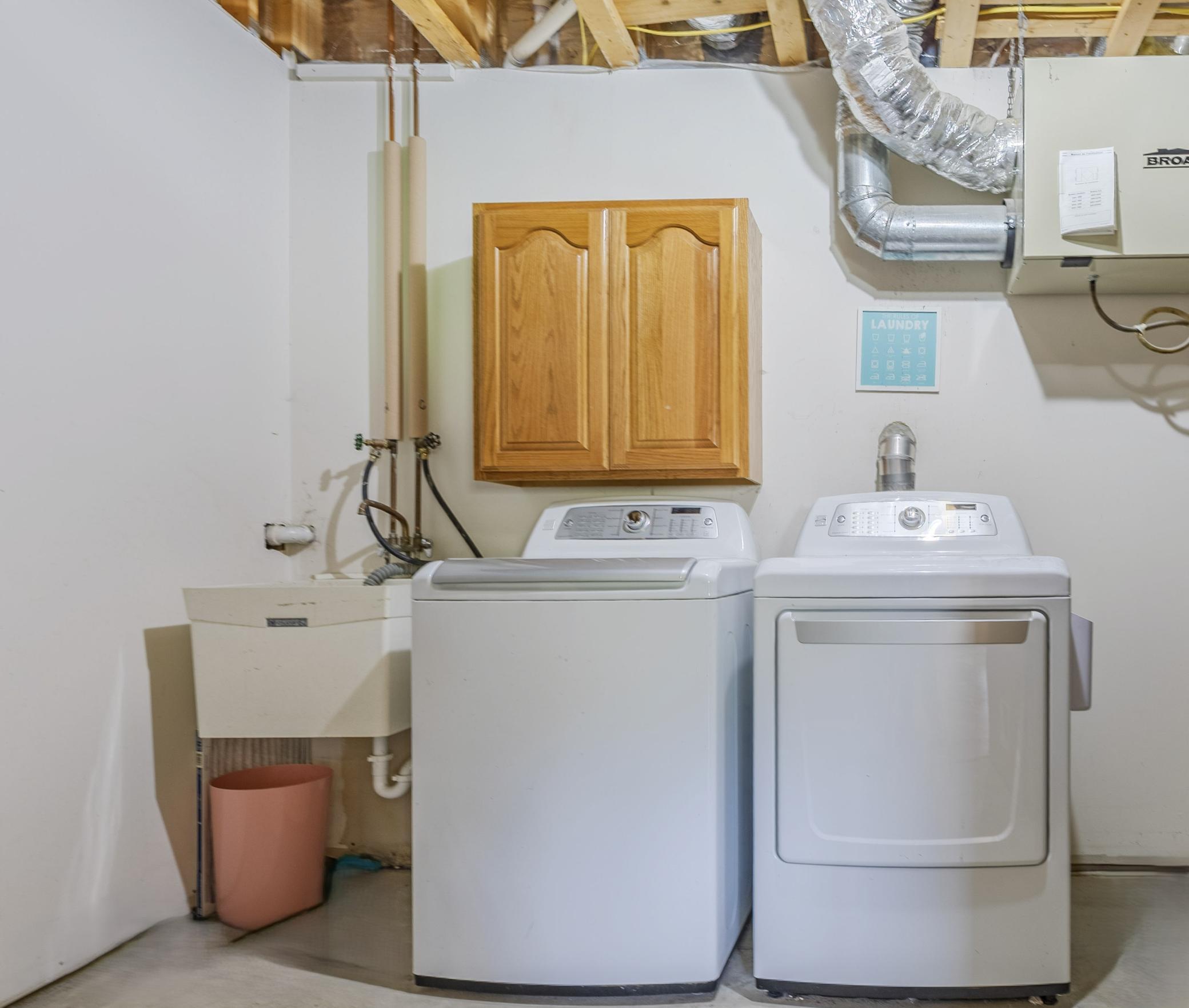Laundry room with sink and built-in storage.