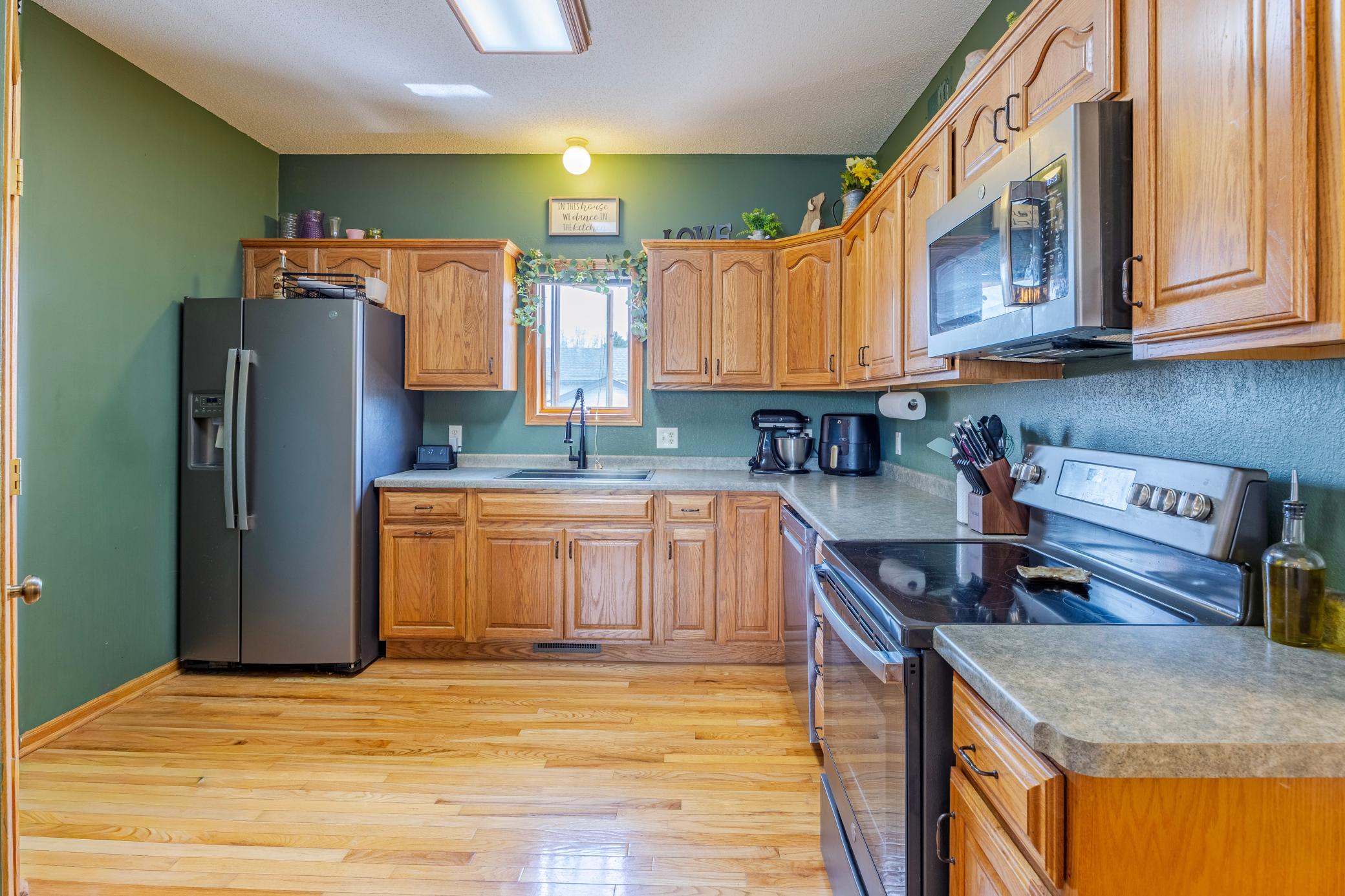 Bright morning sun greets you in the open kitchen. Room for a breakfast nook.