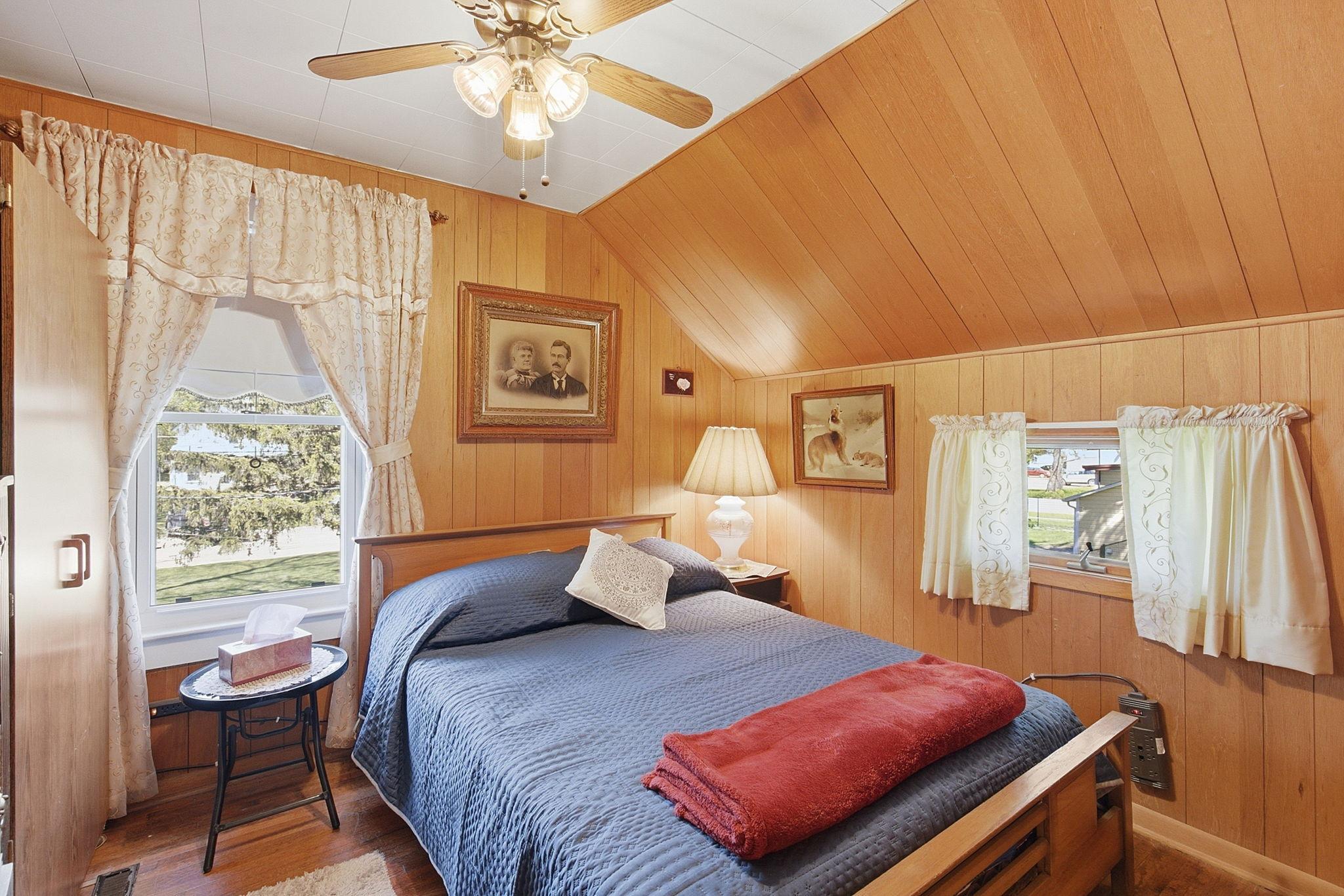 This bedroom has built-in storage shelves.