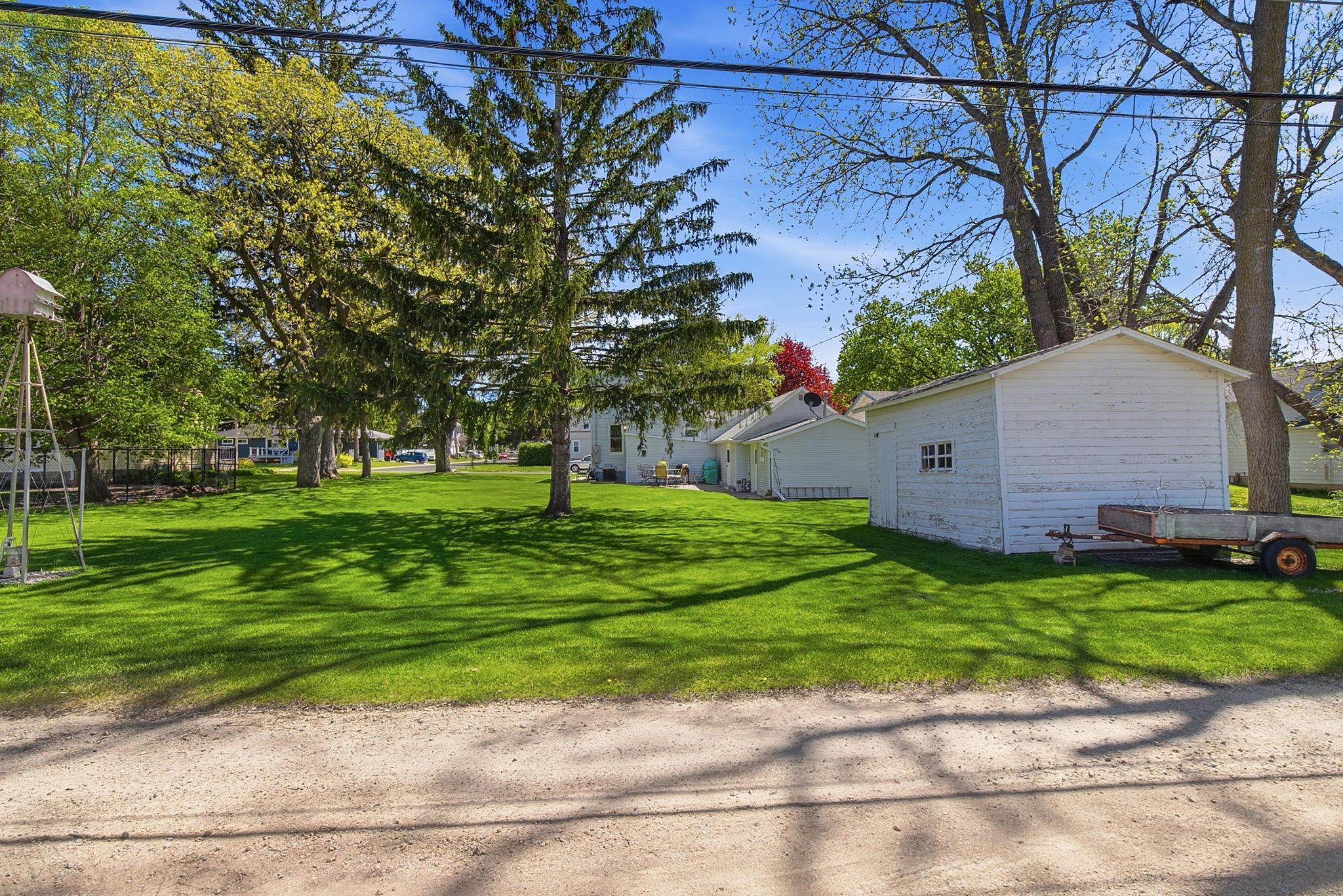 Super convenient alley access, and an addtional garage sized storage shed.